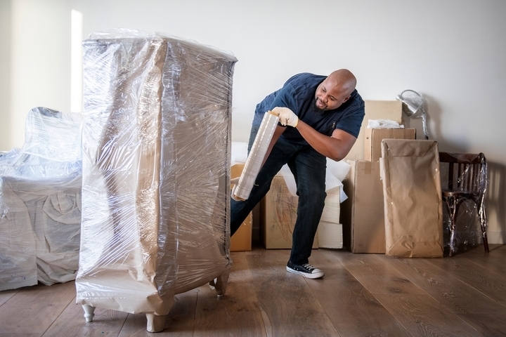 Cover your bulky furniture when moving in bad weather.